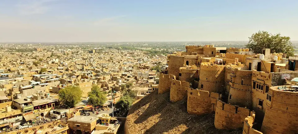 Golden sandstone ramparts of Jaisalmer Fort above the old city