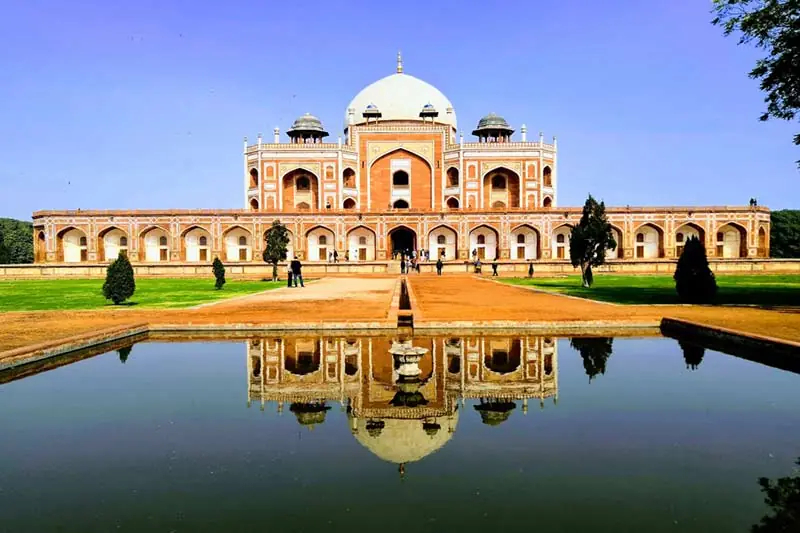 Humayun's Tomb in Delhi reflected in a garden pool