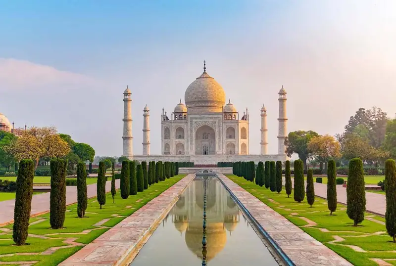 The Taj Mahal at the end of its long reflecting pool and cypress-lined gardens