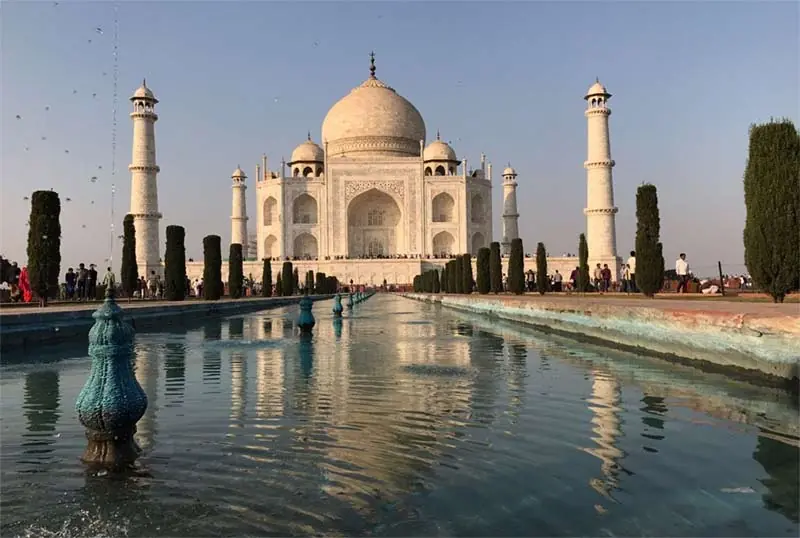 The Taj Mahal and its reflecting pool on a clear morning